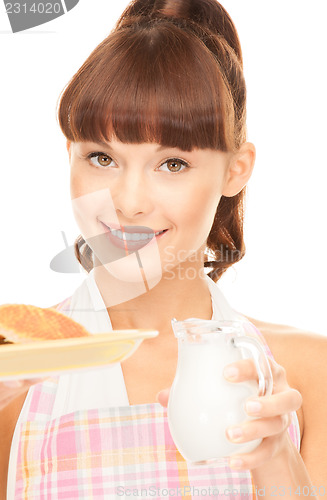 Image of housewife with milk and cookies