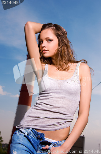 Image of young sexy woman in blue jeans