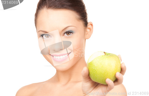 Image of young beautiful woman with green apple