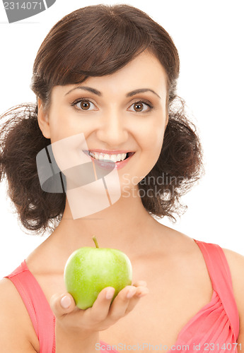 Image of young beautiful woman with green apple