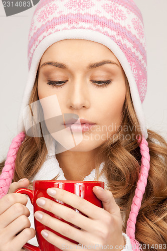 Image of beautiful woman with red mug