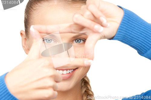 Image of lovely woman creating a frame with fingers
