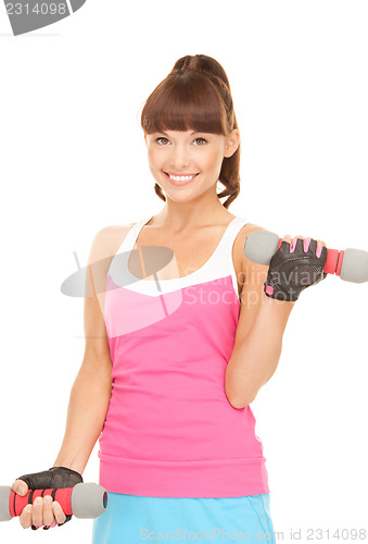 Image of fitness instructor with dumbbells