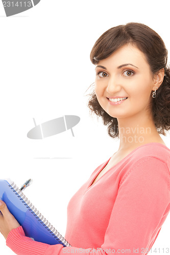 Image of young attractive businesswoman with notebook