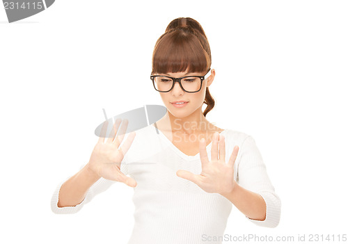 Image of businesswoman working with something imaginary