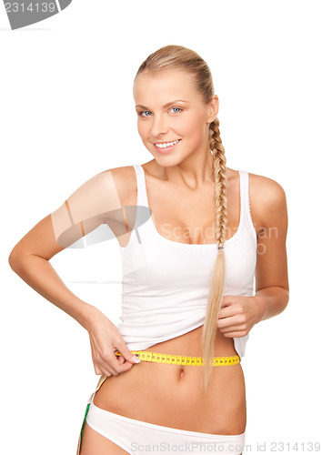 Image of beautiful woman with measure tape