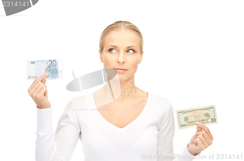 Image of woman with euro and dollar money notes