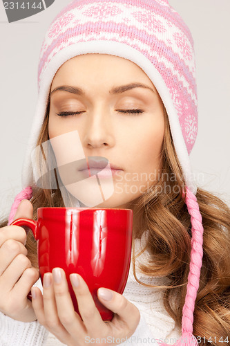 Image of beautiful woman with red mug