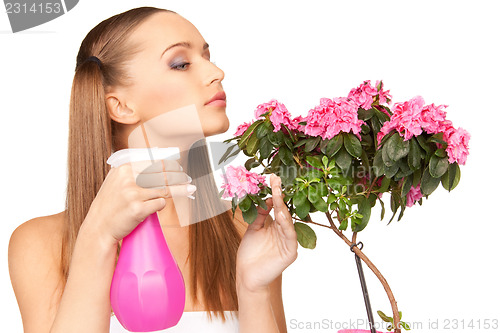 Image of lovely housewife with flowers