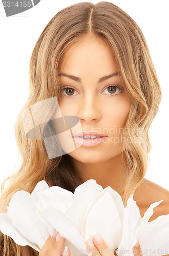 Image of beautiful woman with white flower