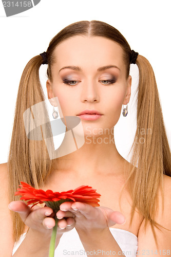 Image of woman in towel with red flower