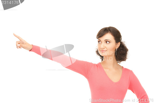 Image of attractive businesswoman pointing her finger