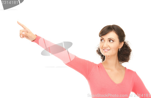 Image of attractive businesswoman pointing her finger