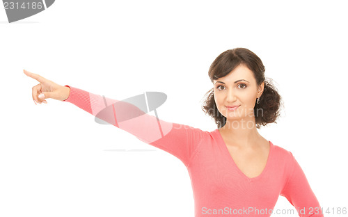 Image of attractive businesswoman pointing her finger