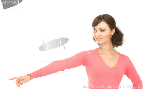 Image of attractive businesswoman pointing her finger