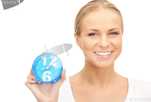 Image of woman holding alarm clock