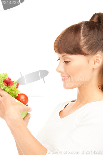 Image of beautiful housewife with vegetables
