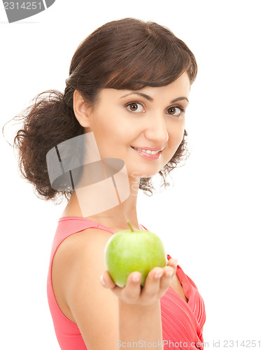 Image of young beautiful woman with green apple