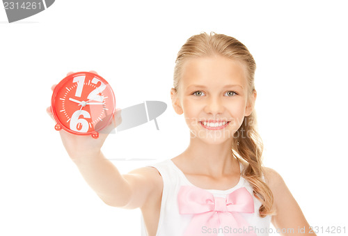 Image of girl holding alarm clock