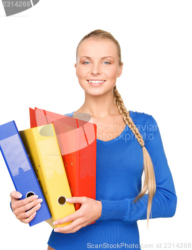 Image of young attractive businesswoman with folders