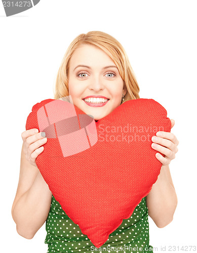 Image of woman with red heart-shaped pillow
