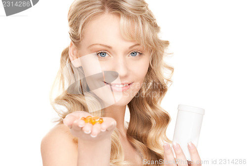 Image of young woman with pills