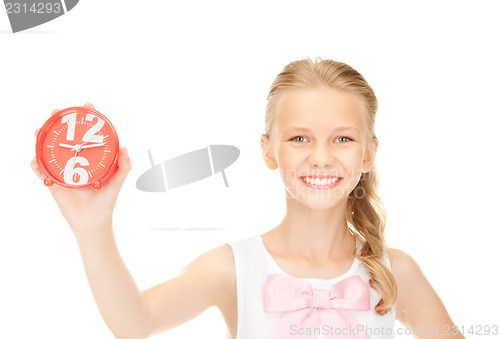 Image of girl holding alarm clock