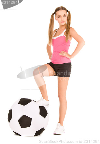 Image of lovely woman with big soccer ball