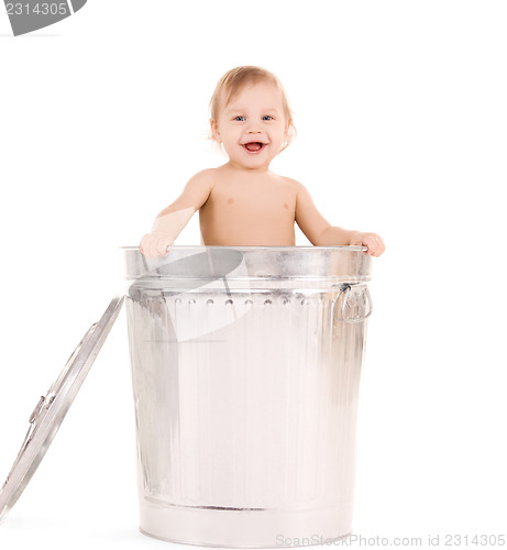 Image of baby in trash can