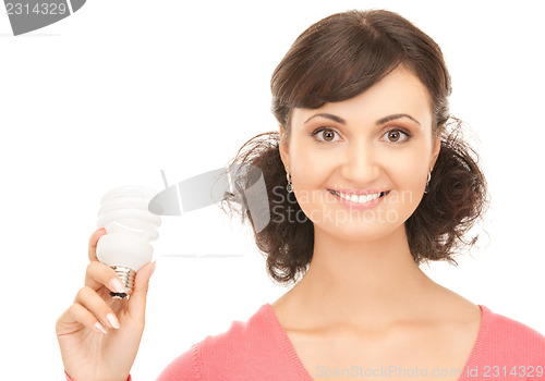 Image of woman holding energy saving bulb