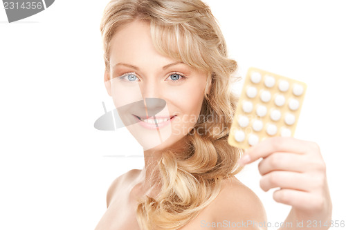 Image of young woman with pills