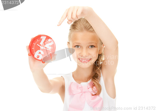 Image of girl holding alarm clock