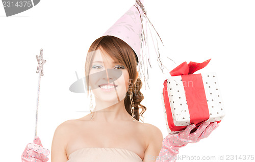Image of teenage party girl with magic wand and gift box