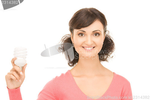 Image of woman holding energy saving bulb