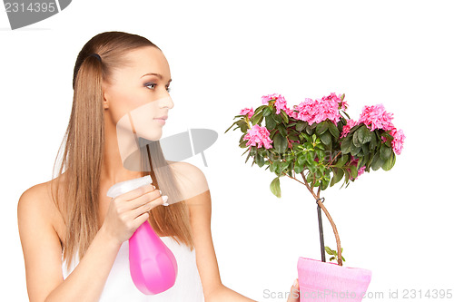 Image of lovely housewife with flowers