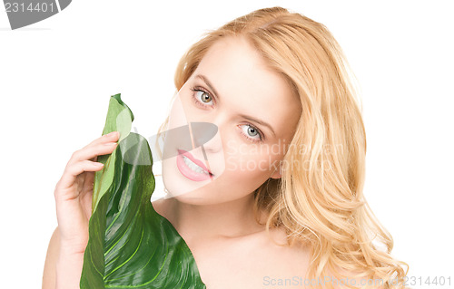 Image of woman with green leaf