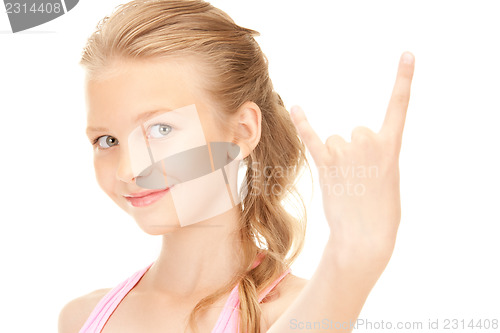 Image of happy girl showing devil horns gesture