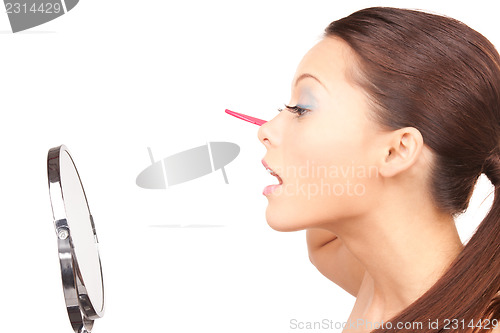 Image of beautiful woman with comb