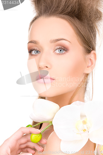 Image of beautiful woman with white flower