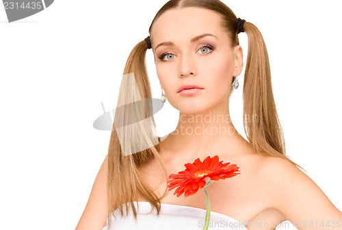 Image of woman in towel with red flower