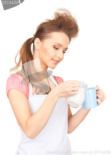 Image of housewife with milk and mug