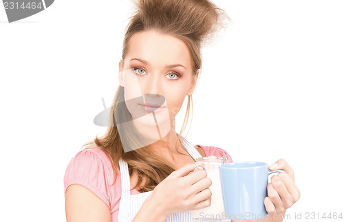 Image of housewife with milk and mug