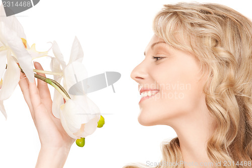 Image of beautiful woman with white flower