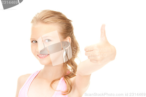 Image of lovely girl showing thumbs up sign