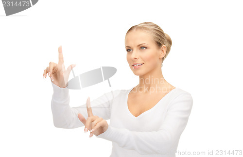 Image of businesswoman working with something imaginary