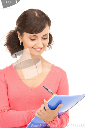 Image of young attractive businesswoman with notebook