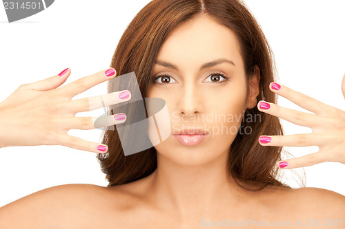 Image of lovely woman with polished nails 