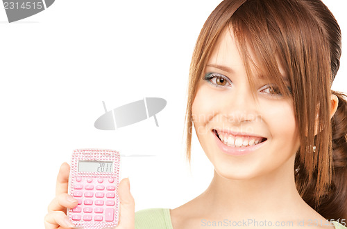 Image of lovely teenage girl with calculator