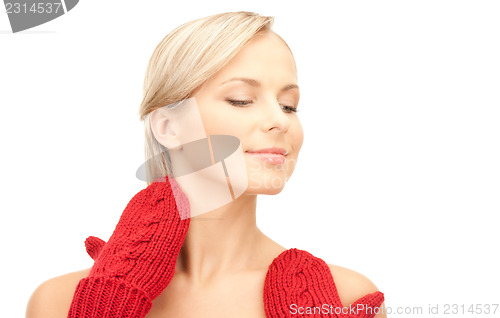 Image of beautiful woman in red mittens 