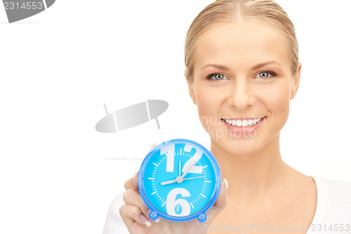 Image of woman holding alarm clock